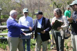 First Selectman Jim Marpe presenting the We Green Award to Westport Electric Car Club president Leo Cirino