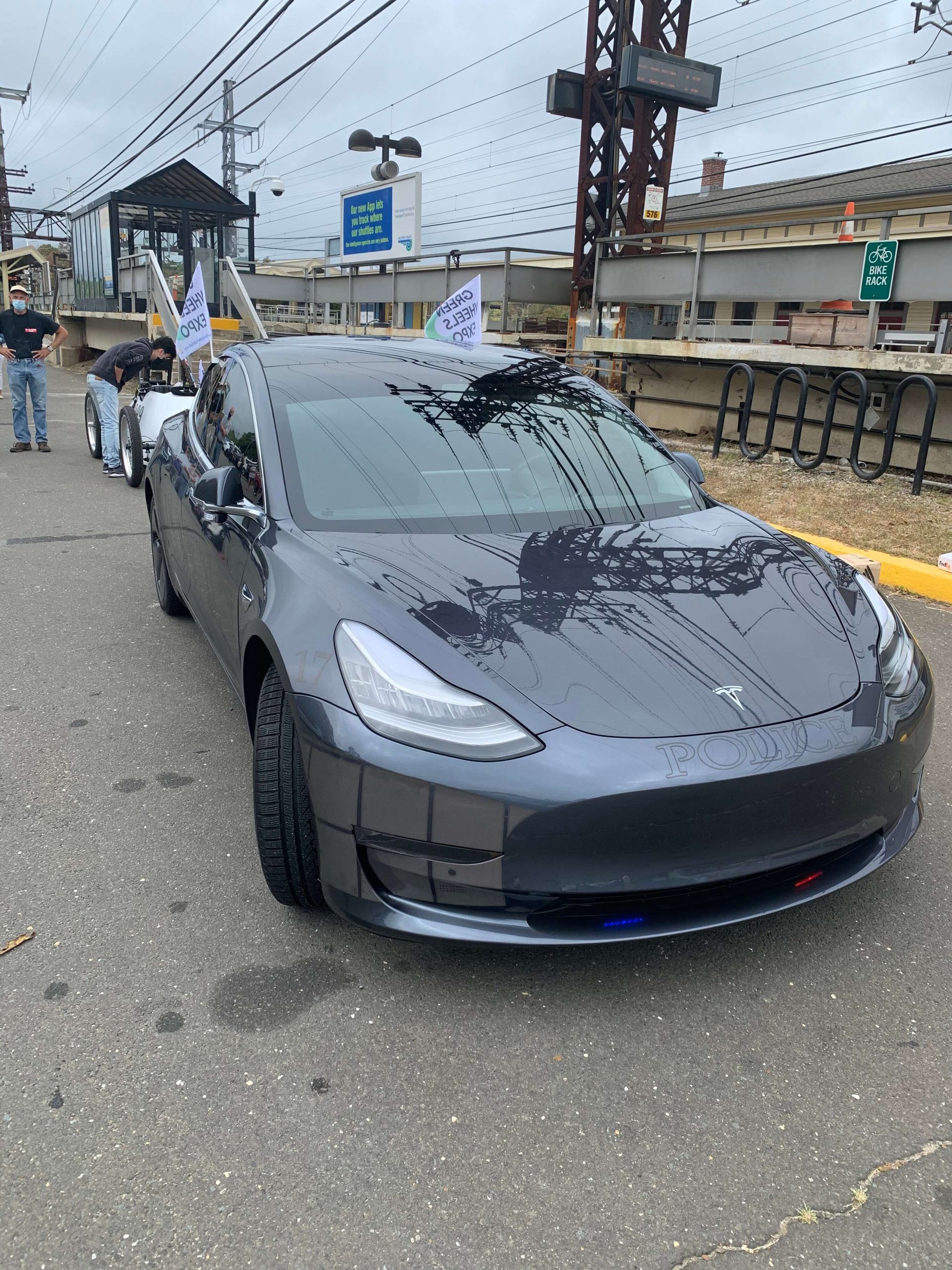 Westport Police Model 3 with Flags for EV Parade