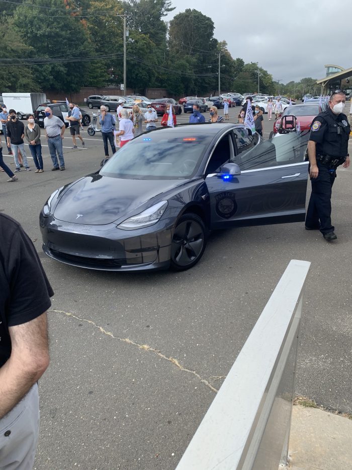 Westport Police Escort the EV parade in their Model 3 Cruiser